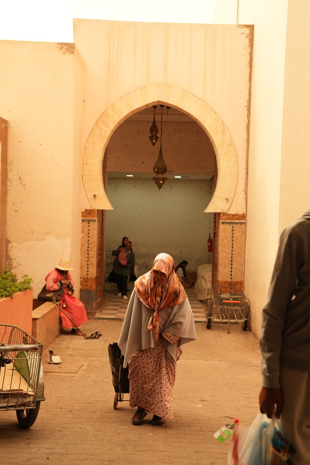 woman in a souk archway, Agadir